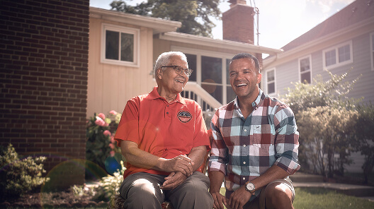 A U.S. Navy Officer sits with a family member.