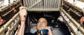 A United States Navy Interior Communications Electrician troubleshoots a communications system aboard the USS James E. Williams destroyer ship.