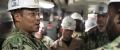 Rear Adm. Kenneth Epps, Deputy Chief of Staff for Fleet Ordnance and Supply/Fleet Supply Officer, U.S. Fleet Forces Command, receives a brief from Culinary Specialist 1st Class Charles Masten, from Philadelphia, assigned to USS Gerald R. Ford's supply department.